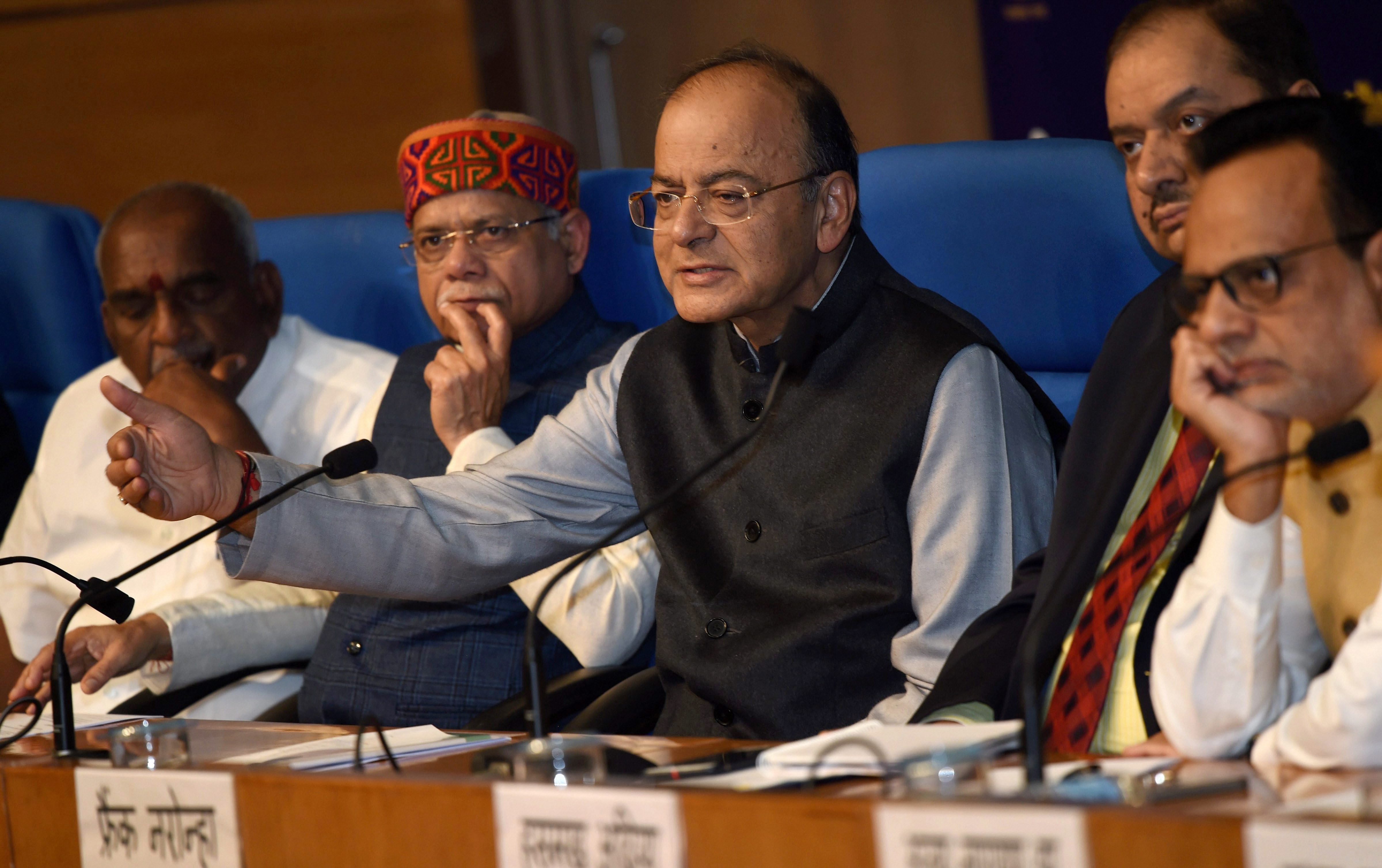 Union minister for finance and corporate affairs Arun Jaitley with the minister of state for finance Shiv Pratap Shukla addresses a press conference after Union Budget 2018-19 presentation, in New Delhi on Thursday. Credit: PTI/Subhav Shukla
