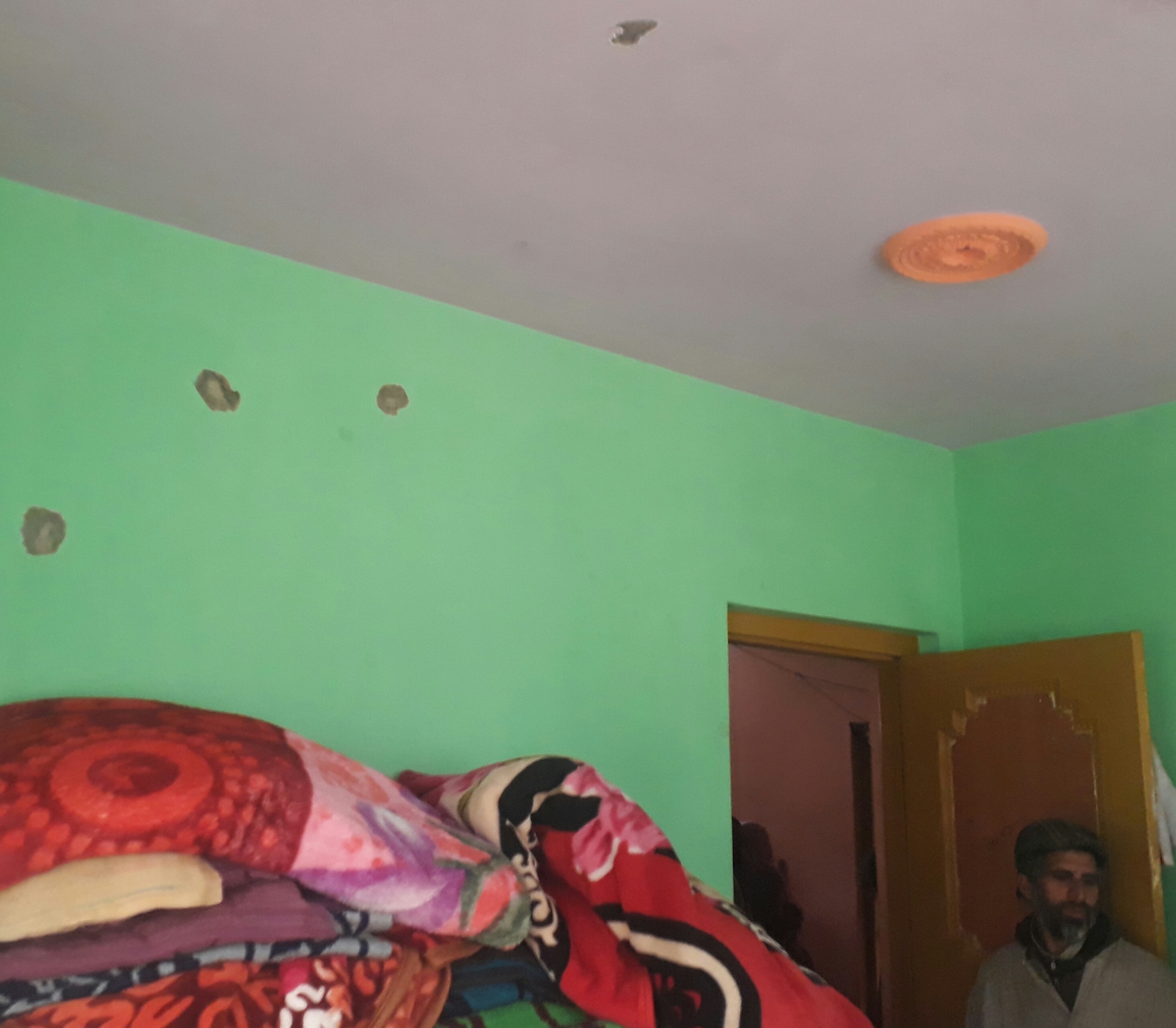 Marks from bullets allegedly fired by security forces in the Lone family house. Credit: Mudasir Ahmad