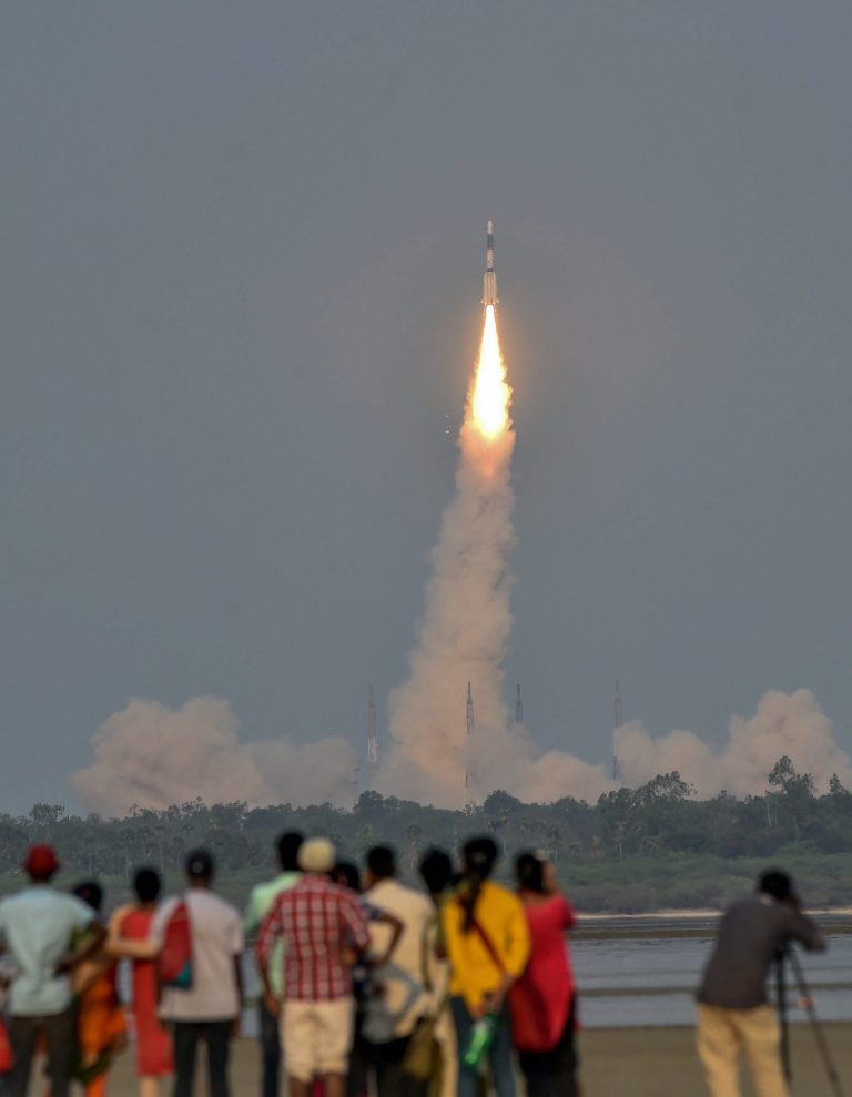 People look on as ISRO's GSLV-F08 carrying GSAT-6A communication satellite blasts off into the orbit from Satish Dhawan Space Centre, in Sriharikota on Thursday. Credit: PTI / R Senthil Kumar