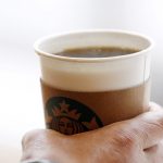 FILE PHOTO: A man holds an Americano at a Starbucks coffee shop in Seoul, South Korea, March 7, 2016. Credit: Reuters/Kim Hong-Ji