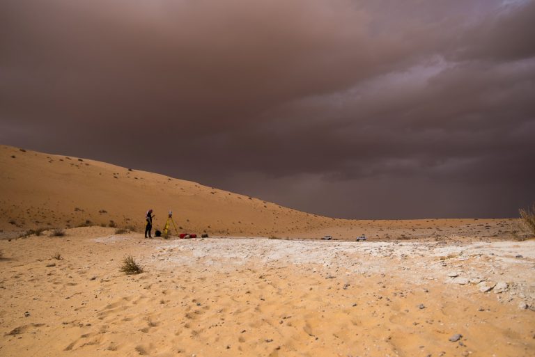 A researcher works on surveying and mapping of the Al Wusta site in the Nefud Desert in Saudi Arabia. Credit: Klint Janulis/Handout via Reuters
