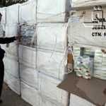A Libyan police officer views a haul of prescription drug Tramadol seized from a shipping container in Tripoli March 3, 2011. Caption and credit: brqnetwork/Flickr, CC BY 2.0