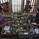 Pharmacists dispense free medication, provided by the government, to patients at RGGGH in Chennai