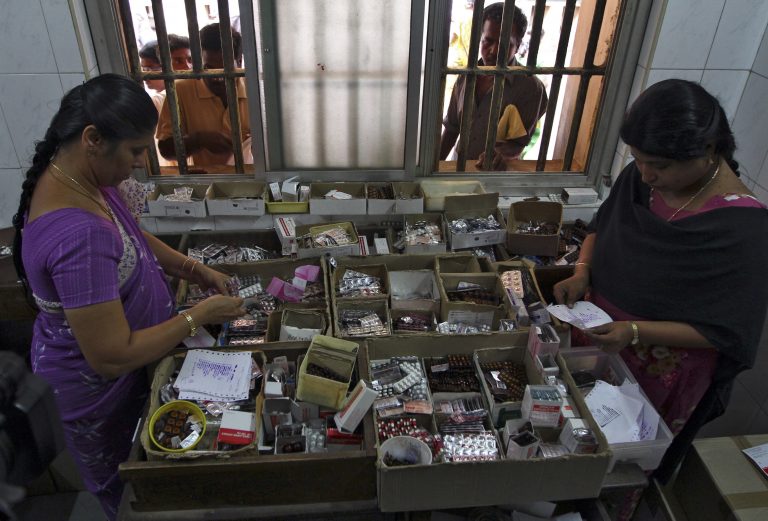 Pharmacists dispense free medication, provided by the government, to patients at RGGGH in Chennai