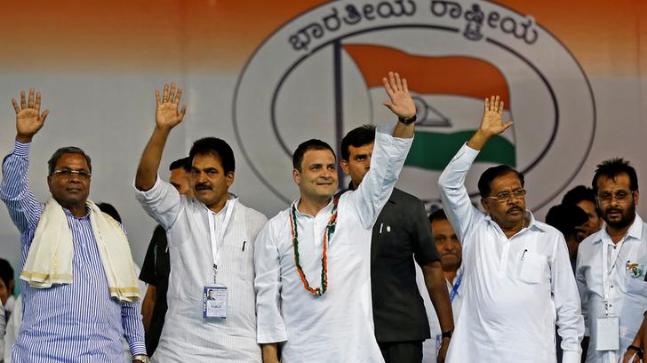 Rahul Gandhi (centre) waves to the crowd before addressing an election campaign rally ahead of the Karnataka state assembly elections. Credit: Reuters
