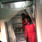 The first batch of 4,000 experimental Ebola vaccines to combat an outbreak is loaded into a fridge as it arrives at the airport in Kinshasa