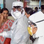 Family members of the patients admitted at the Kozhikode Medical College wear safety masks as a precautionary measure after the Nipah virus outbreak, in Kozhikode, on Monday. Credit: PTI