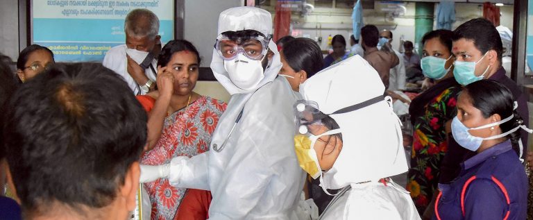Family members of the patients admitted at the Kozhikode Medical College wear safety masks as a precautionary measure after the Nipah virus outbreak, in Kozhikode, on Monday. Credit: PTI