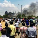 Smoke billowing from burning vehicles after a violent protest demanding closure of Vedanta's Sterlite Copper unit entered the 100th day, in Thoothukudi, on Tuesday. Credit: PTI