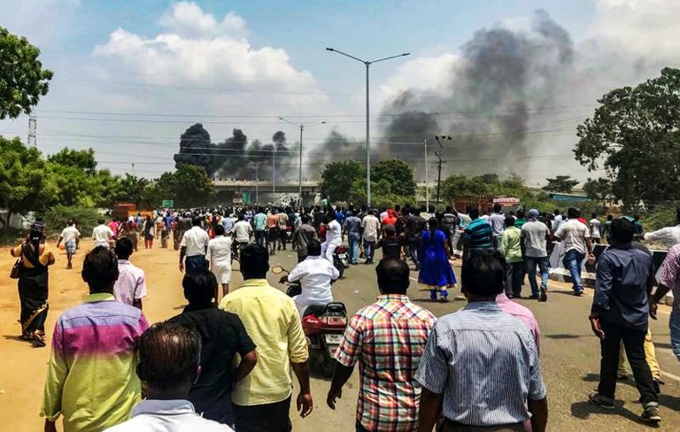 Smoke billowing from burning vehicles after a violent protest demanding closure of Vedanta's Sterlite Copper unit entered the 100th day, in Thoothukudi, on Tuesday. Credit: PTI