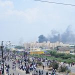 Smoke billows over Thoothukudi after protests demanding the closure of Vedanta's Sterlite Copper unit entered the 100th day on May 22, 2018. Credit: Surya, Tuticorin