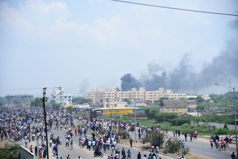 Smoke billows over Thoothukudi after protests demanding the closure of Vedanta's Sterlite Copper unit entered the 100th day on May 22, 2018. Credit: Surya, Tuticorin