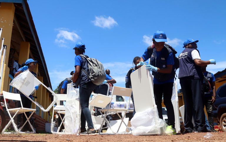 World Health Organization workers prepare a centre for vaccination in the port city of Mbandaka
