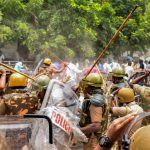 Police personnel baton charge at protestors who were demanding the closure of Vedanta's Sterlite Copper unit, in Tuticorin, on Wednesday. Credit: PTI