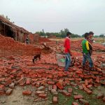 Villagers inspect the damaged house which collapsed during last night's thunderstorm and rain, in Unnao, Uttar Pradesh on Tuesday, May 29, 2018. As many as five persons were killed and four others injured as lightning struck some parts of Unnao district. Credit: PTI