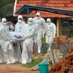 Doctors and relatives wearing protective gear carry the body of a victim, who lost his battle against the brain-damaging Nipah virus, during his funeral at a burial ground in Kozhikode, in the southern Indian state of Kerala, India, May 24, 2018. Credit: Reuters/Stringer