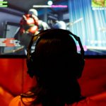 FILE PHOTO: An attendee plays a video game at E3, the world's largest video game industry convention in Los Angeles