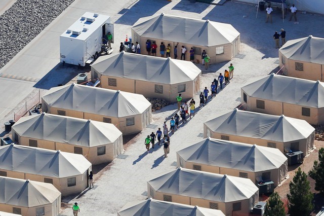 Immigrant children now housed in a tent encampment under the new 