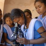 Students_of_Hata_Muniguda_school_seeing_through_a_microscope