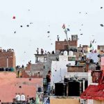 File photo of people flying kites in Old Delhi. Credit: Reuters