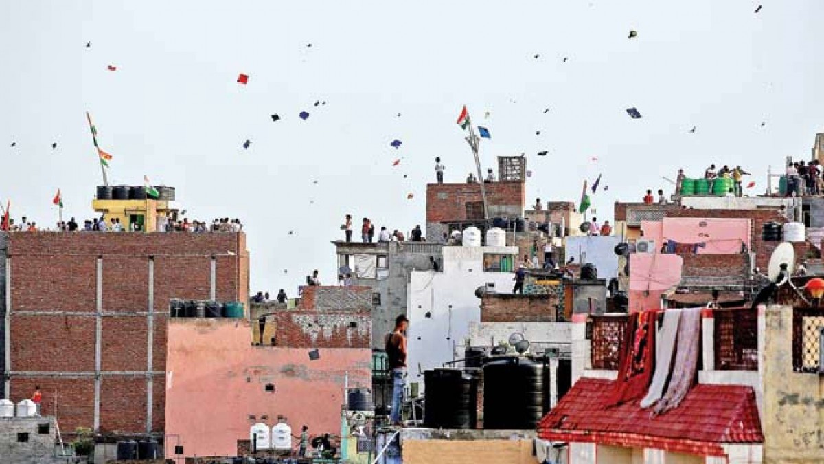 File photo of people flying kites in Old Delhi. Credit: Reuters