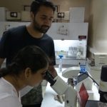 Team member Sriparna Mukherjee, and Irshad Akbar engaged in research work. Credit: India Science Wire