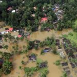 An aerial view shows partially submerged houses at a flooded area in the southern state of Kerala