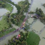 An aerial view shows a partially submerged road in Kerala, August 2018. Credits: Reuters