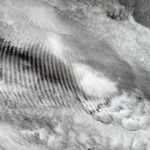 A fingerprint-like gravity wave feature occurs over a deck of marine stratocumulus clouds over the Indian Ocean, October 2003. Caption and credit: NASA/GSFC/LaRC/JPL, MISR Team