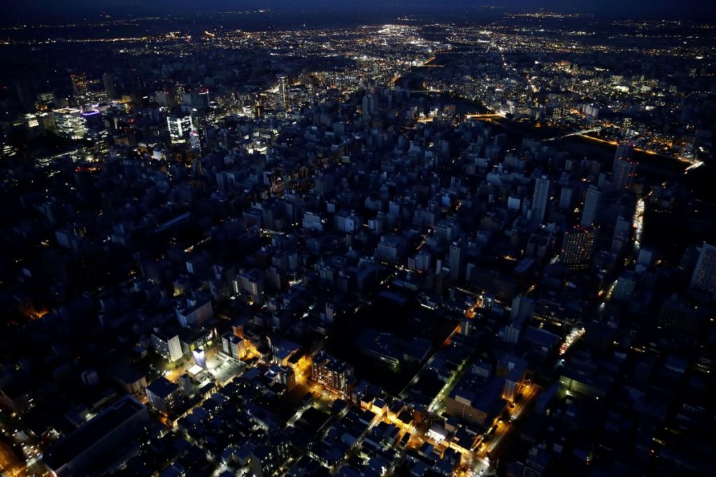 FILE PHOTO: An aerial view shows central Sapporo city during blackout after an earthquake hit the area in Sapporo, Hokkaido, northern Japan, in this photo taken by Kyodo September 6, 2018. Credit: Kyodo/via REUTERS