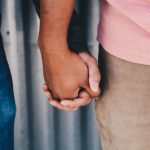 Two people holding hands. Credit: Jenna Jacobs/Unsplash