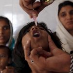 File photo of a girl receiving polio vaccine drops at a government dispensary in a Karachi slum