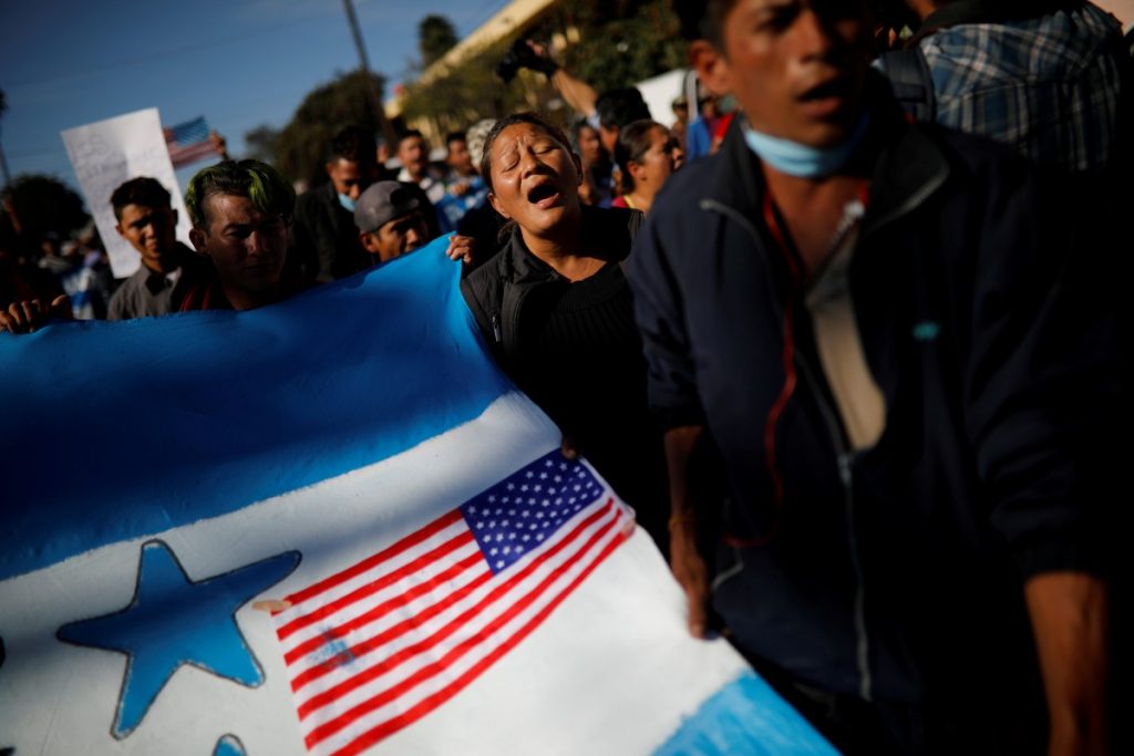 Migrants, part of a caravan of thousands traveling from Central America en route to the United States, take part in a protest march towards the border wall between the U.S. and Mexico, in Tijuana, Mexico November 25, 2018. Credit: REUTERS/Alkis Konstantinidis TPX IMAGES OF THE DAY