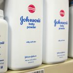 FILE PHOTO: Bottles of Johnson & Johnson baby powder line a drugstore shelf in New York October 15, 2015. Credit: REUTERS/Lucas Jackson/File Photo