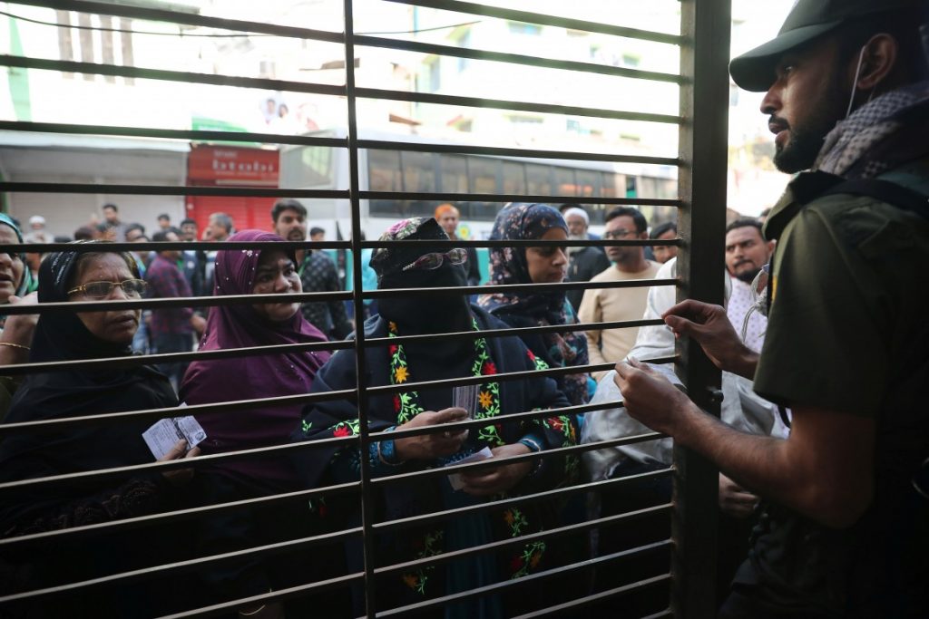 A security personnel checks the serial number of a female voter during the general election in Dhaka, Bangladesh, December 30, 2018. Credit: REUTERS/Mohammad Ponir Hossain