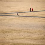 FILE PHOTO: People walk in Greenwich Park, London