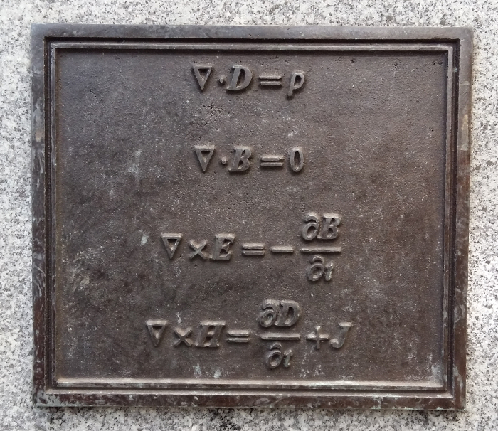 Maxwell’s equations of electromagnetism, engraved below his statue in Edinburgh. Source: Author provided