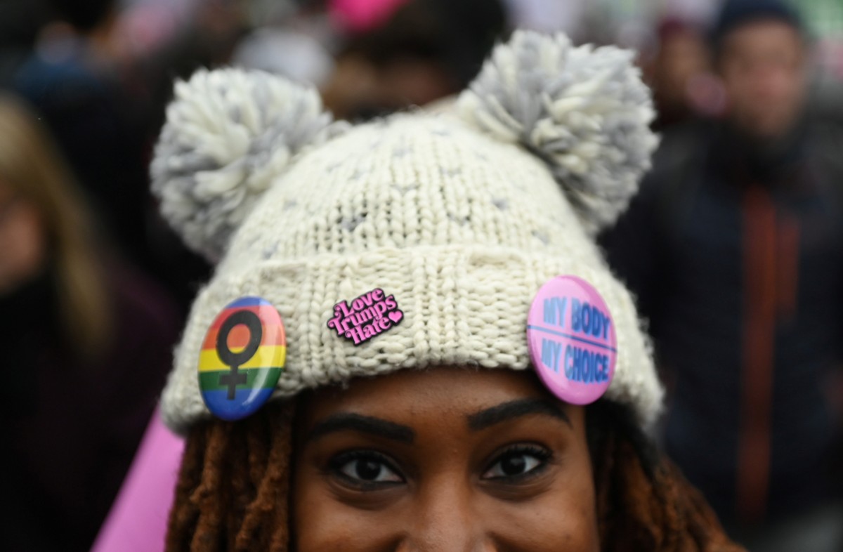 A woman wears "Love Trumps Hate" and "My Body My Choice" pins as she participates in the Third Annual Women's March at Freedom Plaza in Washington, U.S. January 19, 2019. Credit: REUTERS/Erin Scott