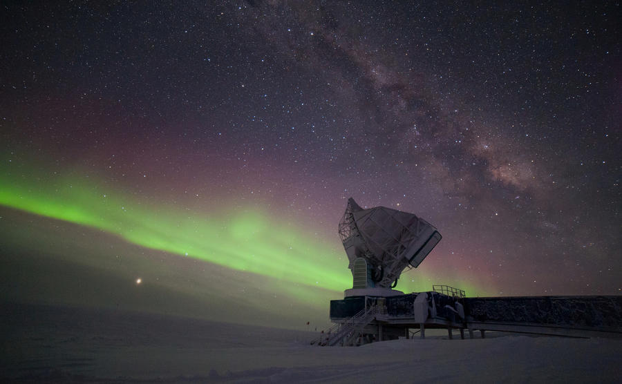 The South Pole Telescope illuminated by aurora australis and the Milky Way. Jupiter is brightly visible on the lower left, Saturn is located to the right of the telescope. The outside temperature is -60º C. Caption and credit: Daniel Michalik/South Pole Telescope