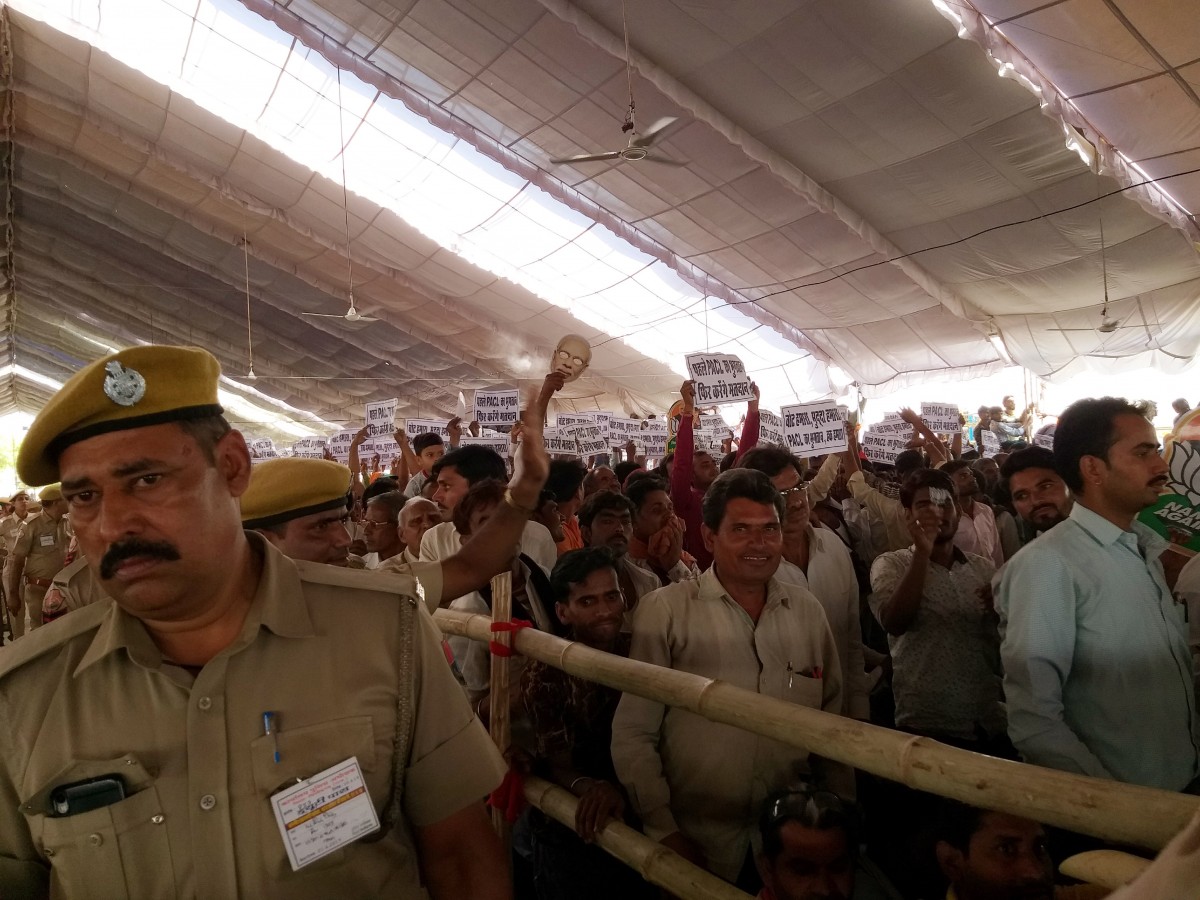 Thousands of protestors raised placards at Modi's rally. Credit: Shruti Jain