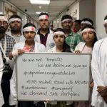 Members of the Resident Doctors' Association of AIIMS in New Delhi wear bandages as a mark of protest on Thursday.