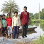 Children-from-Pichodi-stand-near-the-reservoir-waters-that-have-advanced-two-kilomentres-in-the-last-month-copy