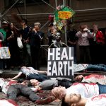Climate change activists protest on Wall St in Lower Manhattan during Extinction Rebellion protests in New York City, New York