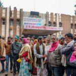 Family members and relatives of their infant children wait outside the JK Lone hospital, in Kota district. Photo: PTI