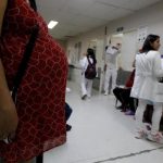 Pregnant woman waits for a routine general checkup, which includes Zika screening, at the maternity ward of the Hospital Escuela in Tegucigalpa