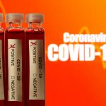 Fake blood is seen in test tubes labelled with the coronavirus (COVID-19) in this illustration