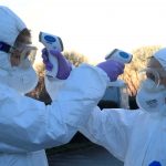 Medical staff use thermometers during checks for coronavirus (COVID-19) at the border crossing with Italy in Vrtojba