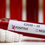 Fake blood is seen in test tubes labelled with the coronavirus (COVID-19) in this illustration