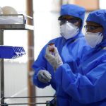 FILE PHOTO: Medical staff with protective clothing are seen inside a ward specialised in receiving any person who may have been infected with coronavirus, at the Rajiv Ghandhi Government General hospital in Chennai
