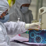 Medics collect test samples in New Delhi. Photo: PTI